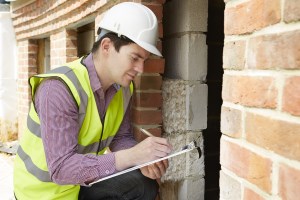 An image of an inspector performing a pre purchase or pre sale building inspection