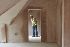 An image of an inspector performing a renovation building inspection